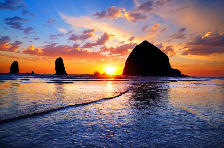 Haystack Rock at sunset in Cannon Beach on the Oregon Coast.