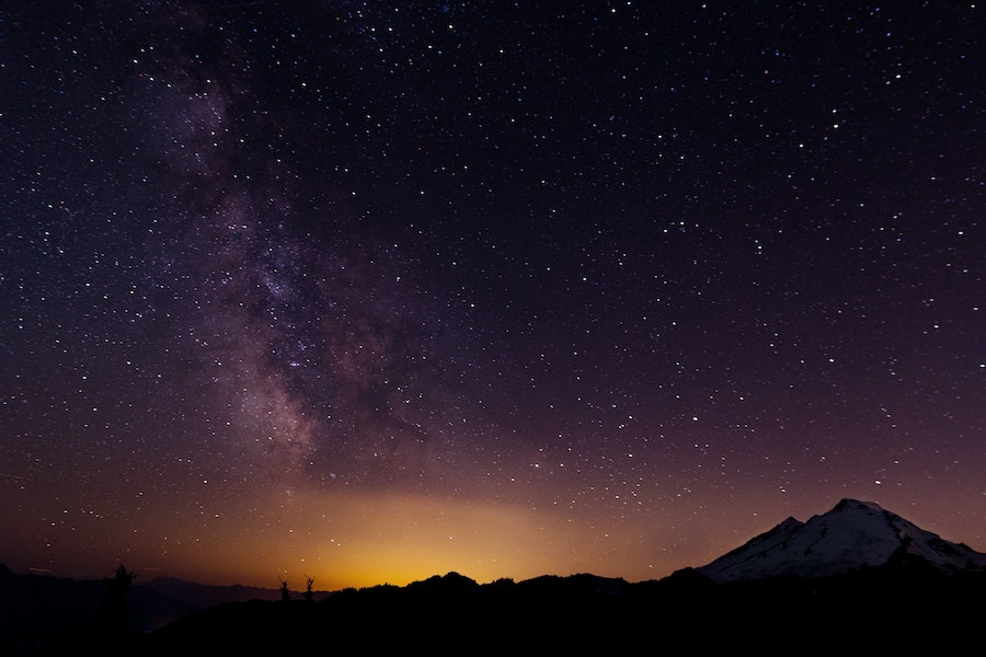 Milky way over Mount Baker-Snoqualmie National Forest at night.