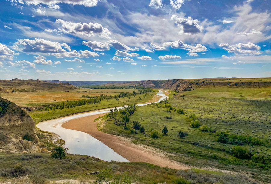 Little Missouri River running through plains and badlands landscapes in Theodore Roosevelt National Park in North Dakota.